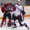 Justin Van Herk of the Fort Macleod Mustangs battles Byron Jackson of the Peigan Cowboys.