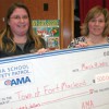 Alberta Motor Association School Safety Patrol regional co-ordinator Allison Pike presented a $500 cheque Wednesday for Fort Macleod Family and Community Support Services director Angie O'Connor. The money goes to Fort Macleod Kids First Family Centre for recreation subsidies.