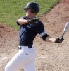 Jake Hansen pounds out a hit Sunday against Crowsnest Pass Panthers.