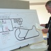 lentilbe Len Tilbe looks at a display of the police college plans Thursday at the Town of Fort Macleod open house.