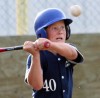 Jayce Van Driesten of the Fort Macleod Cucumbas eyes a pitch.