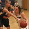 cassiewalmsley Cassie Walmsley of the F.P. Walshe Flyers drives past Tamala Whiteside of the Oilfields Drillers Saturday night in the Blue and White championship game