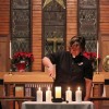 Rev. Pilar Gateman lights the candle of Remembrance. After the performance of the Liturgy of Remembrance candles were lit at an open memorial service