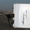 A utility trailer flipped in the southbound lane of Highway 2 on Wednesday afternoon, blocking one lane.