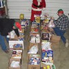 Santa Claus, with help from some Fort Macleod elves, delivered non-perishable food items Christmas Eve to three local families