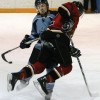 Call Marr of the Fort Macleod Mustangs steps into a Lomond Lakers player during Friday night's game.