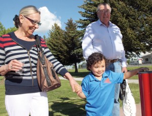 Matthew McNab, accompanied by grandparents Bernadette and Dave McNab, pressed the button to start the water at the spray park.d