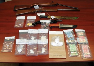 Fort Macleod RCMP seized weapons and drugs from a residence early Friday morning.