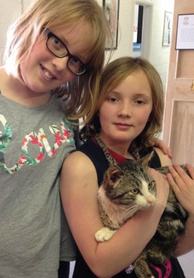 Veronica and Anna Hoskin with their new cat, Gibby, who was brought back to health through the generosity of Fort Macleod residents.