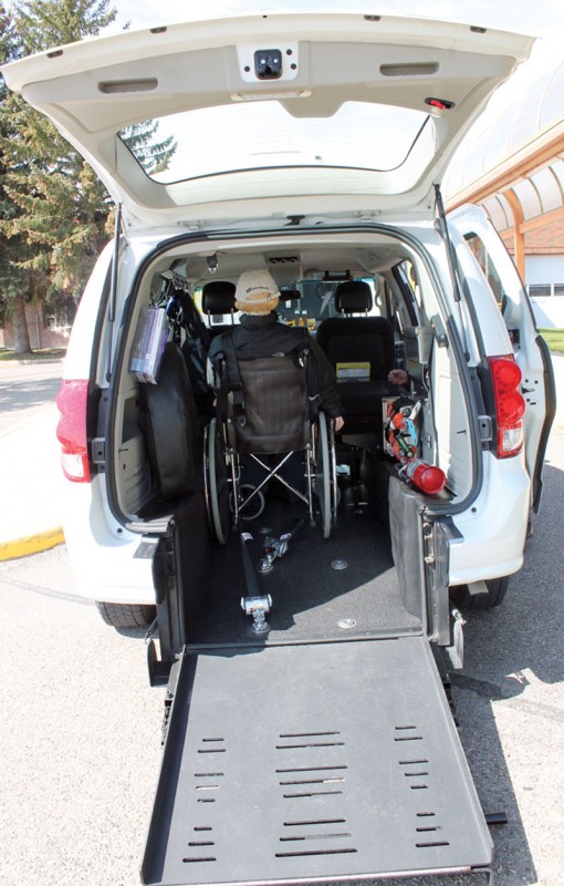 A ramp folds down to allow a wheelchair to be put inside the van.