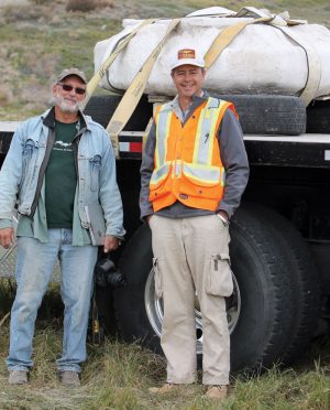 Archeologist Bob Dawe of the Royal Alberta Museum and Darren Tanke, a senior technician with the Royal Tyrell Museum with the roasting pit. 