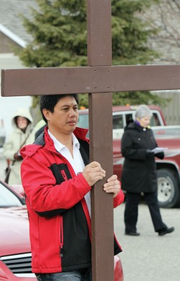 Ronald Montemayor carries cross