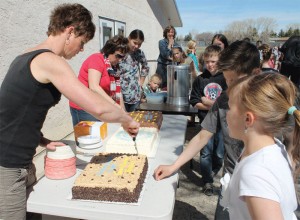 Students and guests lined up for cake at the end of the ceremony.