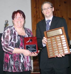 Michelle Harris of Fort Pharmacy accepted the Customer Service Award from Brian Nelson. 