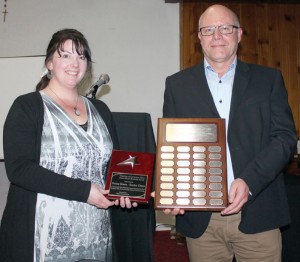 Becky Housenga of Going Green -- EnviroClean accepted the Home-Based Business Award from Theo Vanee.