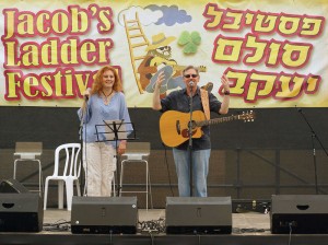 Tim Isberg and his spouse Oxana on stage at Jacob's Ladder, a major folk festival in Israel.