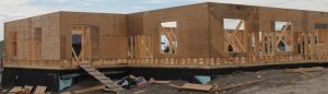 Framing of the lodge's east wing is under way.