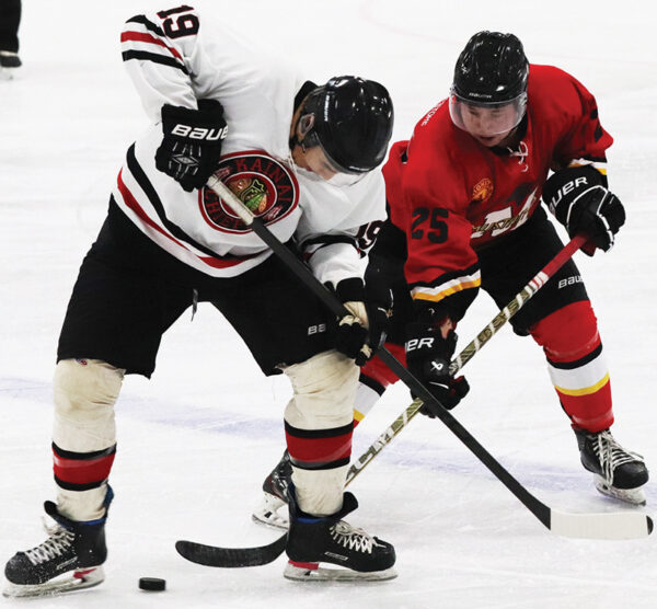 Mustangs battle for the puck