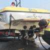 Inspectors decontaminate a boat