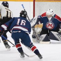 Brydin Wilson of the Havre Ice Hawks breaks in on Fort Macleod Mavericks goalie Owen Archibald, with Kylan Blackwater (16) in pursuit.