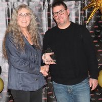 Susan Koots of sponsor Community Futures Alberta Southwest presented the New Business Award to The Penalty Box.