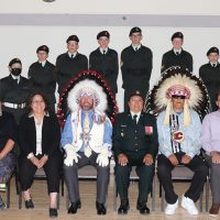 The 2384 Kainai Royal Canadian Army Cadet Corps with guests at the ceremonial review Thursday night at the Fort Macleod and District Community Hall. Back row, from left: Preston Crow Chief, Warrant Officer Emerald Day Chief, Gunner Arianna Klaassen, Master Bombardier Liam Klaassen, Gunner Martin Jansen, Sgt. Jordan Guliker, Bombardier Kendra Klaassen, Gunner Kimberly Jansen, Warrant Officer Levi Slingerland, and civilian volunteer Nathan Slingerland. Front row, from left: civilian instructor Bernadette Edmunds, Blood Tribe councillor Maria Russell, reviewing officer Jim Bennett, Capt. Susan Bruised Head, Wylie Weasel Moccasin and Fort Macleod Mayor Brent Feyter.